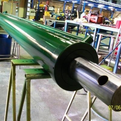 Industrial green roller conveyor in manufacturing warehouse